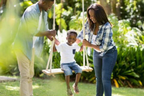 happy family playing in the lawn