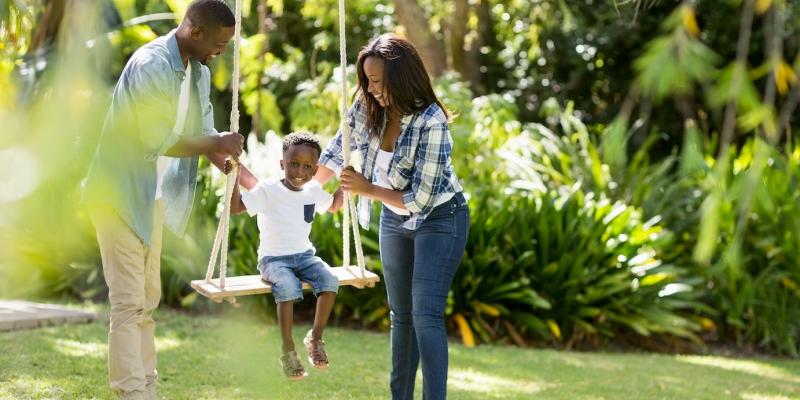 happy family playing in the lawn